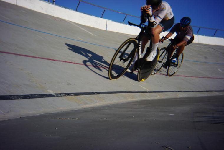 Two riders, long shadows.