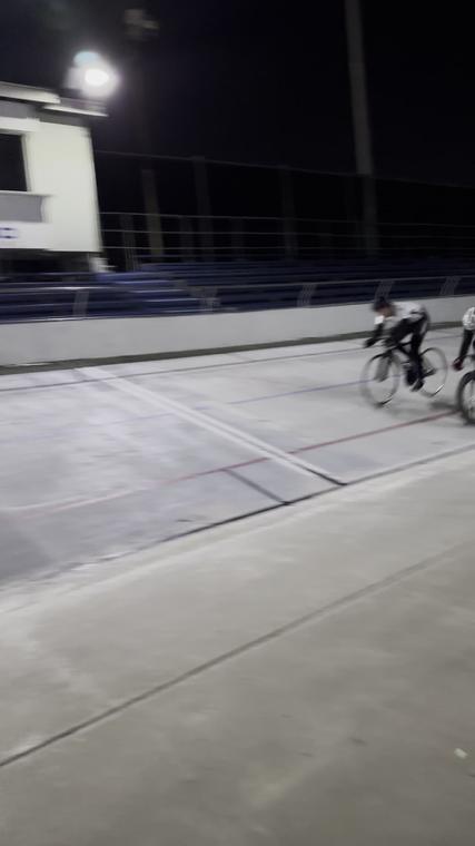 Two riders past the rail at speed. Frame from video.