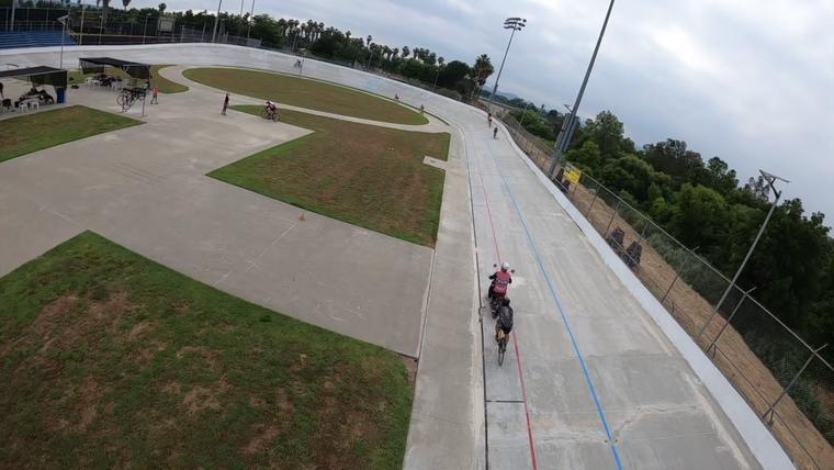 Wide from the motor, rider ahead on the straight. Frame from video.